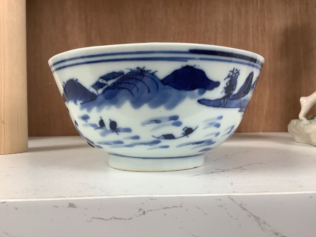 A Chinese blue and white footed porcelain bowl, Kangxi mark to underside, c1900, 12cm diameter 6cm high, together with a further hand painted famille rose, 15cm diameter, 7cm high